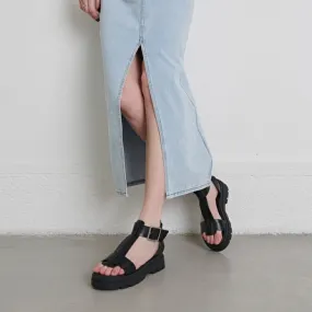 Platform sandals with thick straps in black glazed leather